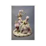 Late 19th/early 20th century large Samson porcelain figure group of seated lovers by a tree with
