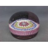 Possibly Whitefriars millefiori paperweight with pontil mark to base, 4 1/2 ins diam