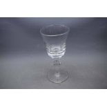 Early 20th century clear glass goblet with knopped stem and a circular foot, 9ins tall