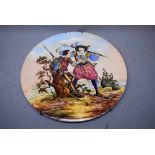 19th century Continental plaque painted in enamel depicting figures of Cavaliers, 12ins diam