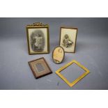 Five assorted varying sized easel back picture frames with black and white photographs (5)