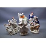 Group of five Staffordshire figures of a Scottish mother and child, a guardsman asleep on duty, a