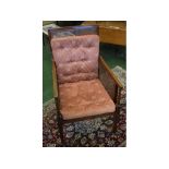 19th century mahogany Bergere armchair with cane sides and back and puce button upholstered cushions