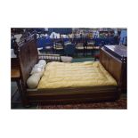 French walnut heavily carved double bed with arch top and squat spindles, with turned columns and