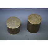 Two Indian brass cylindrical boxes with etched detail, tallest 3 1/2 ins