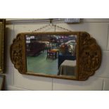 Gold painted rectangular Oriental mirror flanked by carved detail of figures in a garden scene,