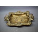 WMF style brass dish with decorative stylised impressed floral detail with figurehead handles, 14ins