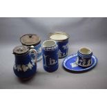 Mixed Lot: deep blue Wedgwood wares comprising a ribbed jug, pewter lidded jug, two biscuit