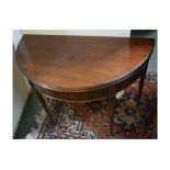 George III mahogany demi-lune fold-over card table with green baize lined interior supported on four