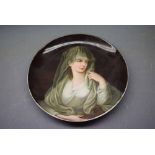 German porcelain plate with a central painted portrait of a veiled young lady, 8 1/2 ins diam