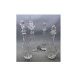 Four 19th century cut clear glass decanters and stoppers, largest 16ins tall