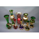 Eight Bohemian crystal glass vases with overlaid gold decoration and painted enamelled flowers,