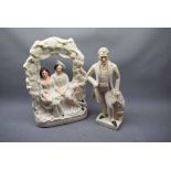 Flat back figure modelled as a lady and gent over a vined arch, together with a further white glazed