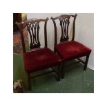 Pair of Chippendale style open splat back dining chairs with heavily carved and scrolled top rail,