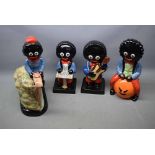 Four Carlton ware Robinson's advertising figures of one playing the guitar, one playing keyboard,