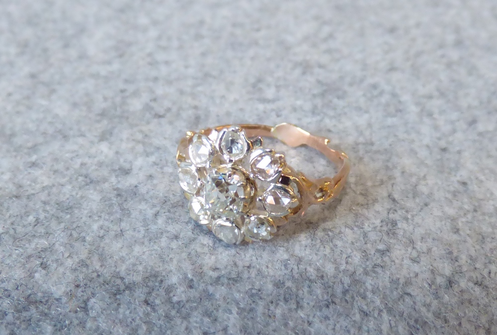 Diamond cluster ring, in the Victorian style, the central old cut brilliant of approx. 0.4cts,