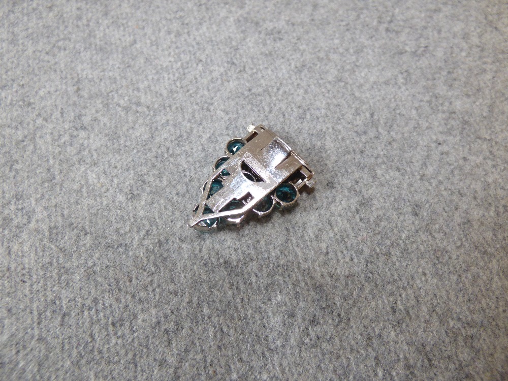 Blue zircon dress clip with white mount stamped '9ct' & numbered '7488', set with nine round cut - Image 3 of 3