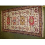 Persian rug, cream ground with stylized animal and bird motifs 125x203cm