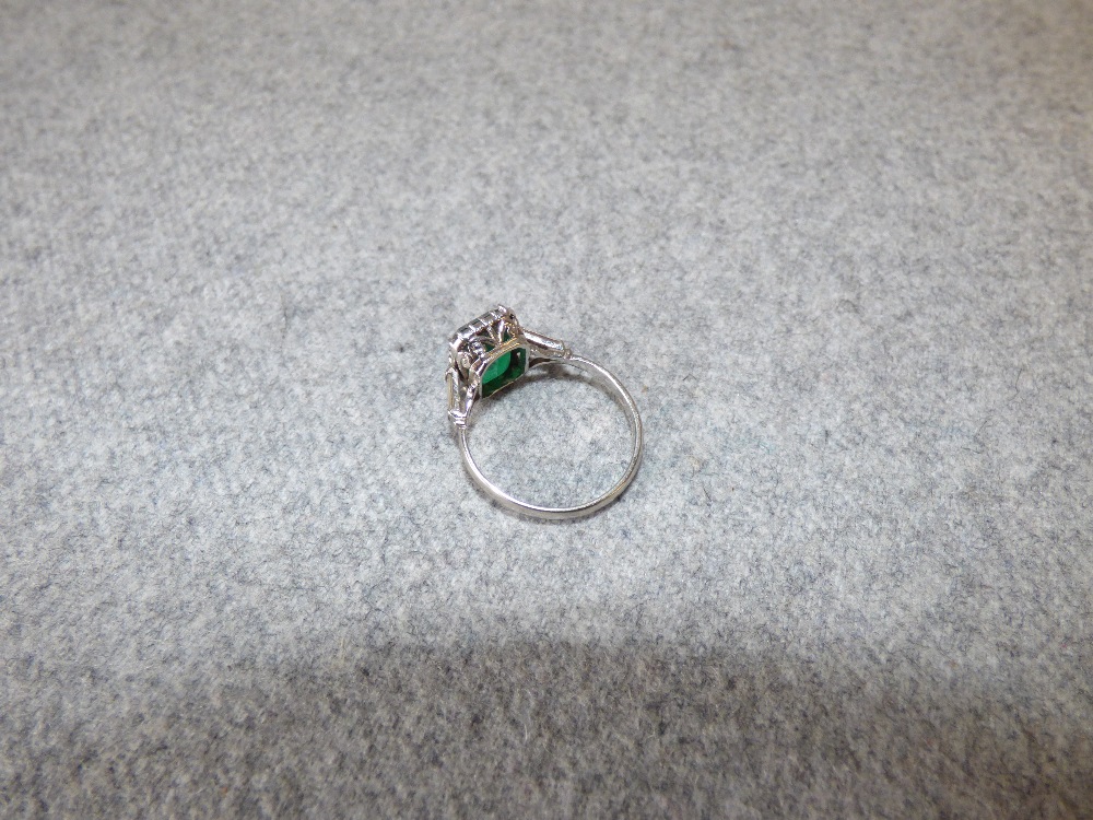 Emerald and diamond platinum ring, 2003, the step cut measuring 10.5mmH x 7.2mmW x 4.9mmD, with a - Image 5 of 9