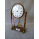 French Brass portico clock with 4 pillars and fruit basket pendulum, enamel dial bearing roman