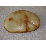 Chinese jade pebble of typical flattened form in brown & green 11cm