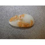 Chinese pale jade and brown tinted pebble carved with phoenix & lily pod 8cm L
