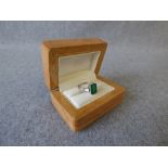 Emerald and diamond platinum ring, 2003, the step cut measuring 10.5mmH x 7.2mmW x 4.9mmD, with a