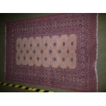 Bokhara rug, mauve ground with gulls and a 5 row border