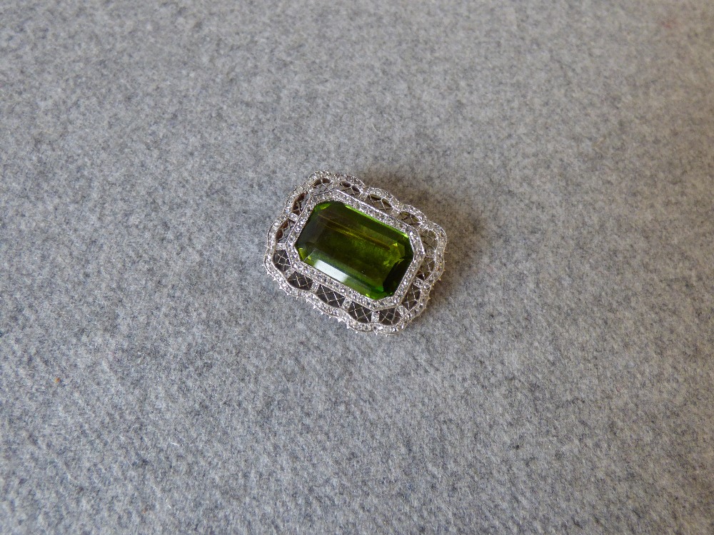 Peridot and rose diamond brooch with step cut of approx. 17.8ct to a shaped diamond set frame,