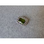 Peridot and rose diamond brooch with step cut of approx. 17.8ct to a shaped diamond set frame,