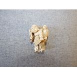 Chinese carved ivory figure of man carrying child PLEASE always check condition before bidding or