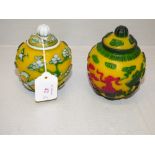 2 similar Chinese Peking yellow glass pots & covers with raised decoration, impressed marks to