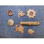 C19th/20th metal detecting artefacts incl. 5 military badges, pip & brass miniature cannon barrel