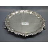 Late Victorian hallmarked silver salver with engraved crest, dragooned shell border on claw & ball