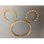 Hollow bangle stamped '375' with a pair of 9ct gold hoop earrings PLEASE always check condition