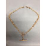 9ct gold watch chain of graduated solid curb links, with a T-bar and two swivels, 41.5cm long, 31.8g