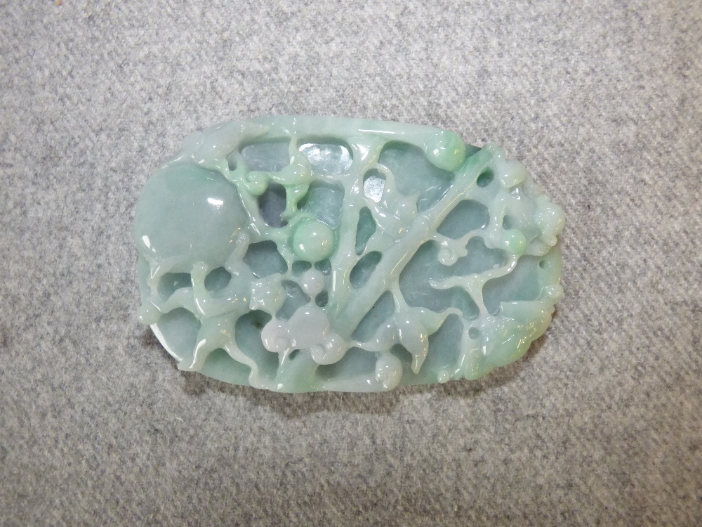 Pale jade carved oval pendant with monkeys in a tree, the base with foliage 18cm L PLEASE always