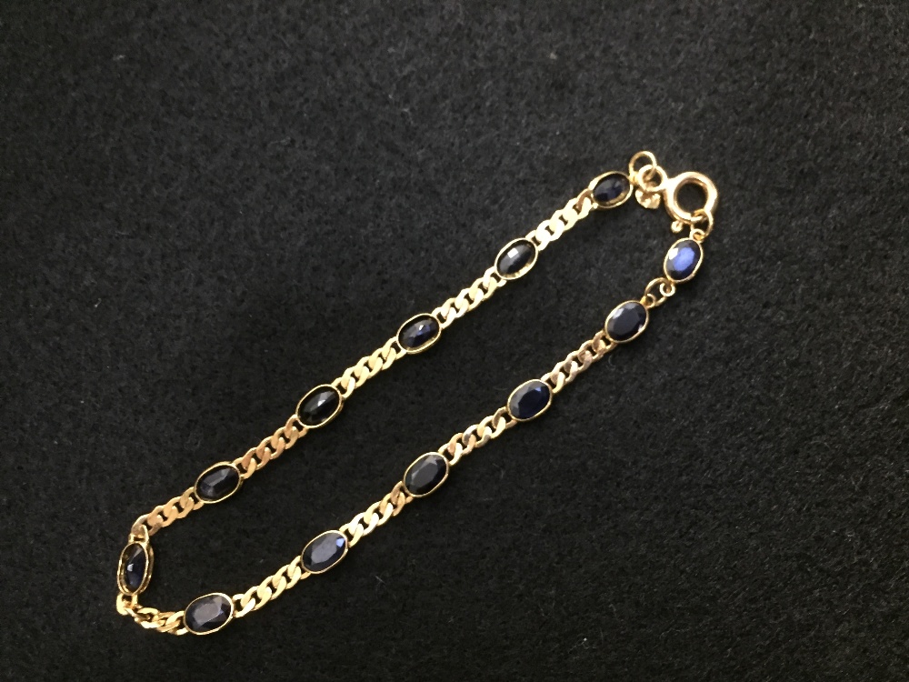 Yellow coloured metal & sapphire chain linked bracelet, marked '750' PLEASE always check condition