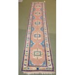 Persian style runner with borders of cream, blue and pinks and central motifs 410L x 94Wcm PLEASE