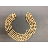 Five row cultured pearl necklace to a 9ct gold clasp, the pearls of approx. 6-7.5mm dia., 32.5cm