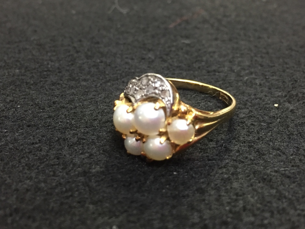 Pearl and diamond dress ring, stamped '18ct', the five split pearls (untested and unwarranted)