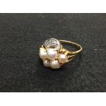 Pearl and diamond dress ring, stamped '18ct', the five split pearls (untested and unwarranted)