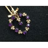 Edwardian amethyst and seed pearl pendant with a ribbon bow seed pearl set bale, 3cm long with a