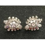 Pair of diamond cluster ear studs, the central eight stone brilliant cut cluster enclosed by five