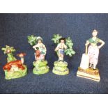 A pair of late C18th/early C19th Walton Staffordshire figures, each standing beside a bocage;