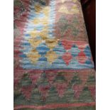 Kunduz Kilim fusion of colour on green and oatmeal background 211x156