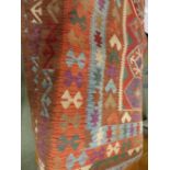 Kunduz Kilim orange and fusion of colour on flecked oatmeal background