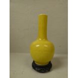 C19th Chinese yellow bottle shaped vase on stand with character marks to base, 25 cm H