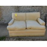 2 seater cream fabric sofa & green stool