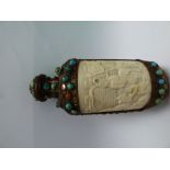 A Ming Dynasty carved ivory and metal studded scent bottle